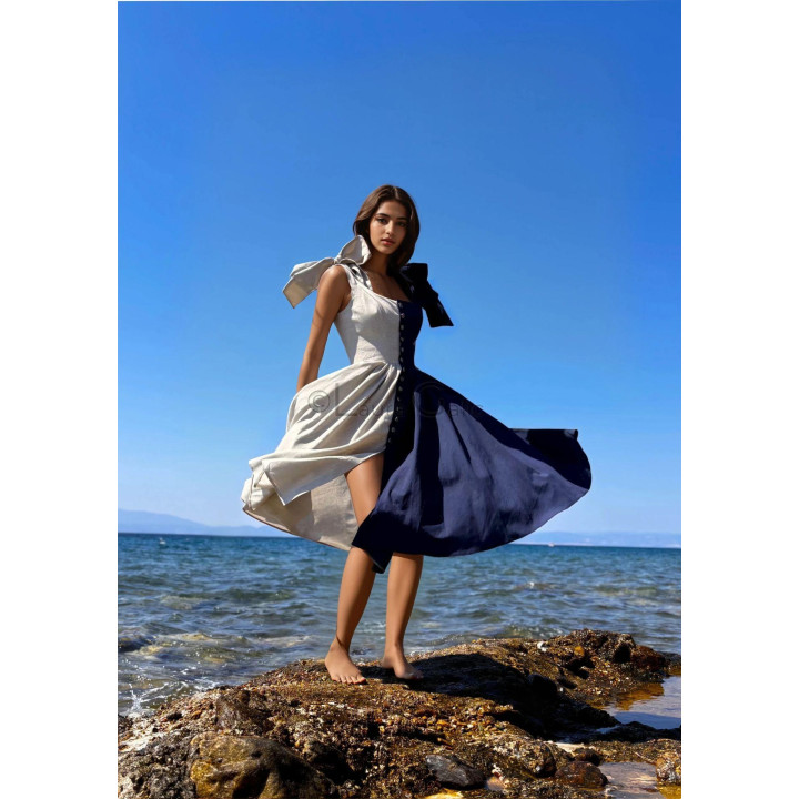 Afrodite dress with a fitted corset, front buttons and a flowing two-tone skirt