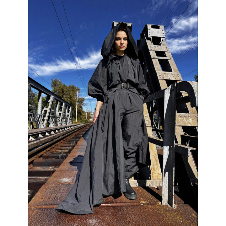 Front view of a women's cape with oversized hood and long train