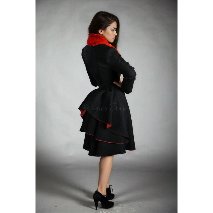 Back of the Gaia 1 coat showing its oversized flared skirt and layered panels