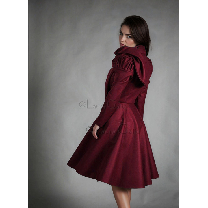 Back view of the Beatrice coat showing its large collar and flared skirt