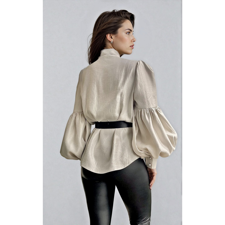 Back view of the Luana shirt showing its full sleeves and oversized cuffs