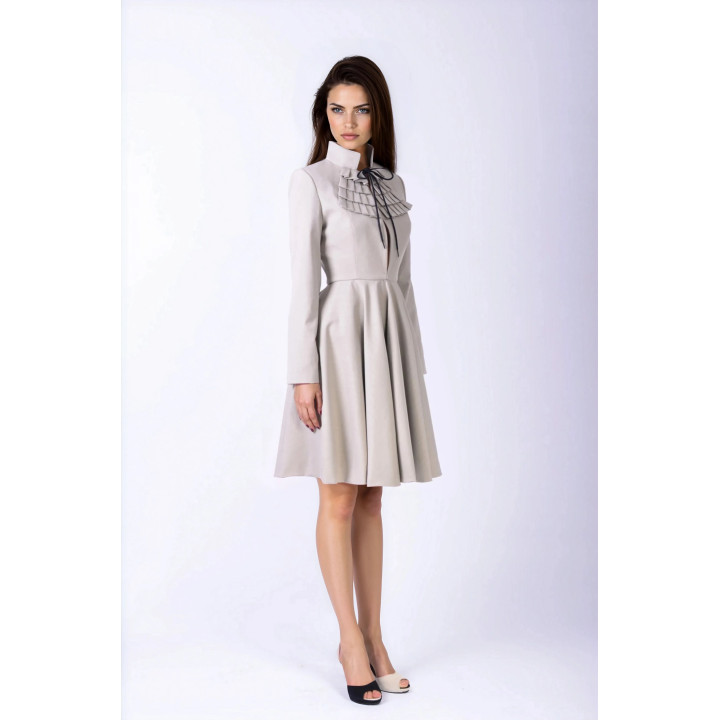 Aurora women’s coat showing its fitted waist and flared hem from a side angle