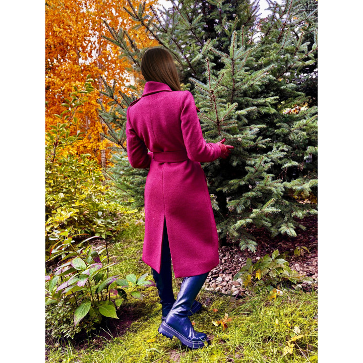 Back view of the Romanita 2 coat with a waist belt and hem vent