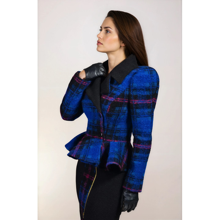 Side detail of the Carmella jacket with black lapels, a pronounced shoulder and checked peplum