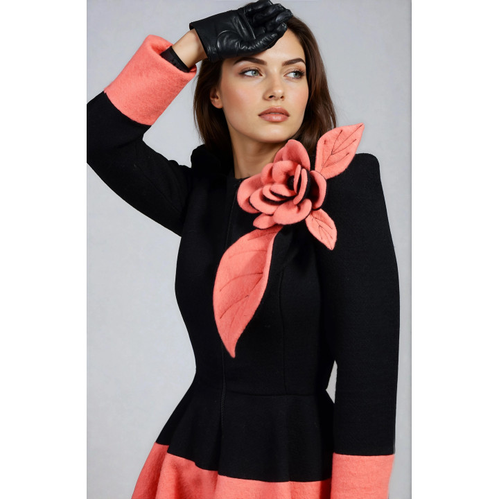 Close-up of the coral flower detail on the black Ariadna coat
