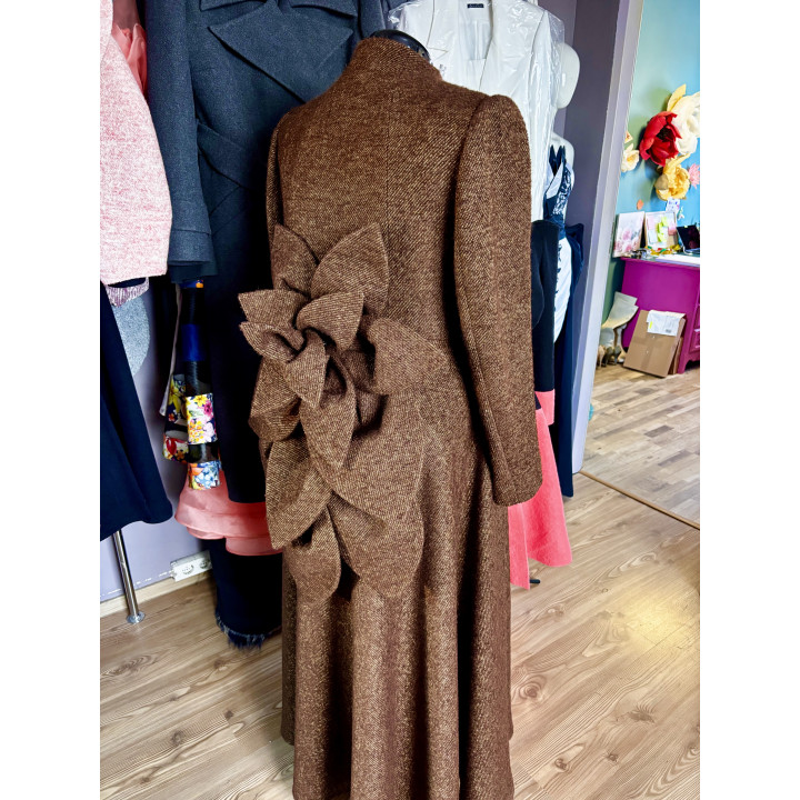 Rear detail of the Tamura Amaryllis coat showing the brown fabric flower