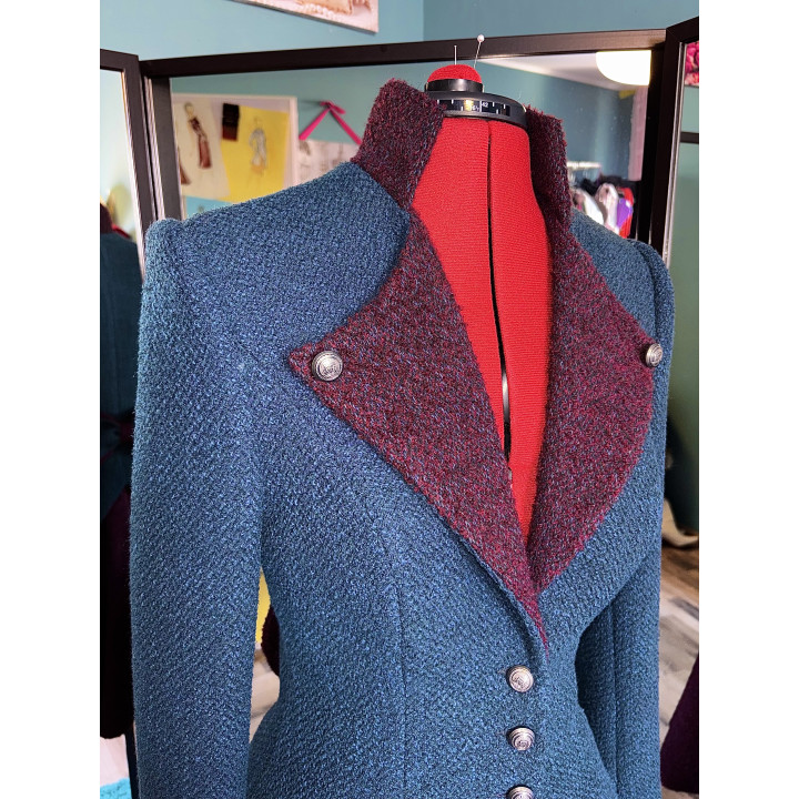 Close-up of the Helga wool jacket's wide burgundy lapels and decorative buttons