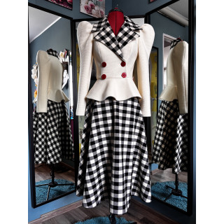 Carmen wool suit with a cream peplum jacket and long black-and-white checked skirt