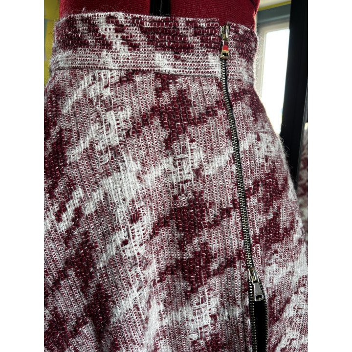 Close-up of the detachable metal zipper on the Robin wool skirt slit