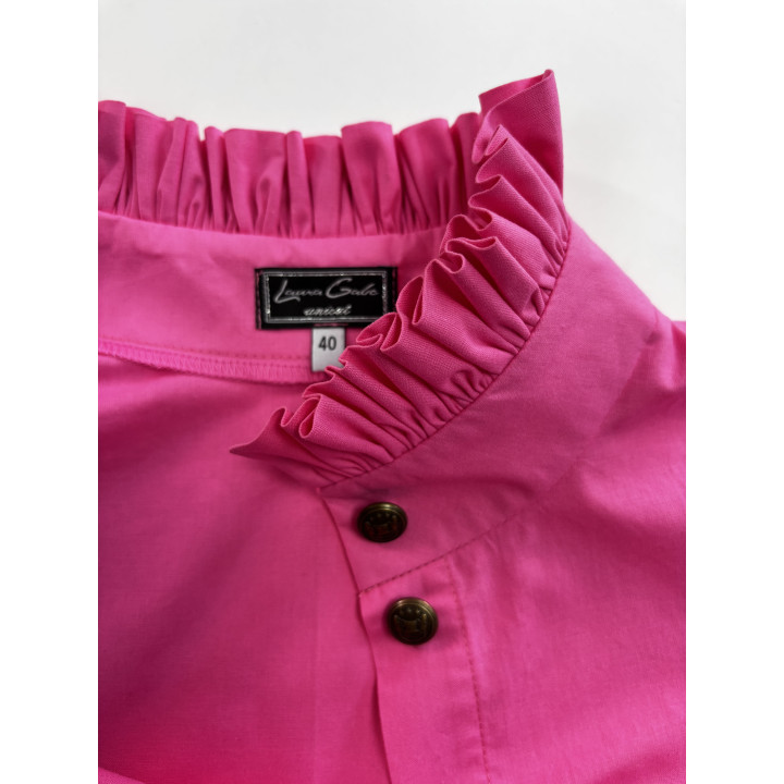 Close-up of the Domenica shirt’s ruffled collar and front buttons