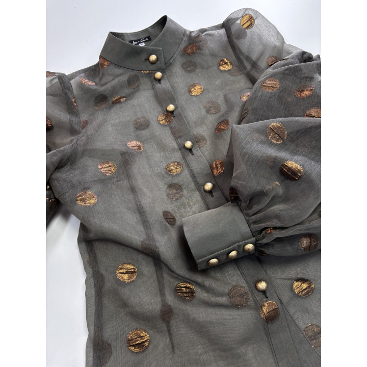 Close-up of the voluminous sleeve and gold-button cuff on the Luana 2 shirt