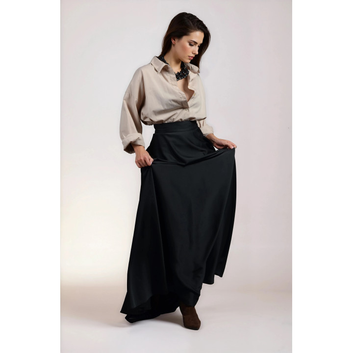 Angled view of the flared Hera 2 maxi skirt and fixed waistband