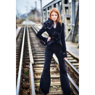 Dark navy flared cotton velvet trousers styled with a dark jacket