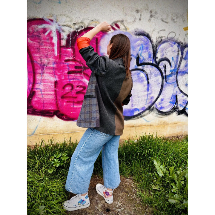 Back view of the Ramona patchwork jacket with contrasting wool fabric panels
